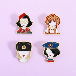Set of four Russian style enamel brooches featuring diverse female character designs