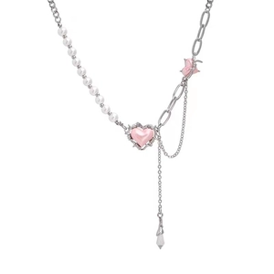 Pink heart pendant necklace with pearls and silver chain in an asymmetrical design
