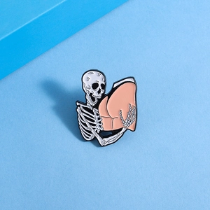 Detailed close-up of punk skeleton hugging peach shape enamel lapel pin badge