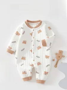 Detail of baby quilted cotton romper featuring brown bear print and rib knit cuffs