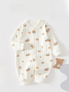 Detail of baby cotton jumpsuit with cute panda prints and soft ribbed texture detail