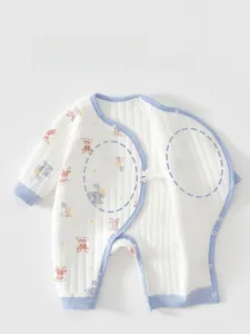 Detail view of quilted cotton baby romper with side snaps and animal prints