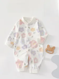 Detailed close-up of a floral cotton baby romper featuring a cute rabbit print pattern