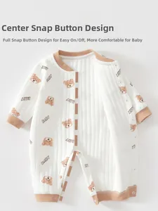 Detail view of baby quilted cotton romper with front snap fasteners and bear print