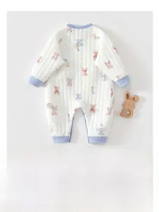 Close-up of quilted cotton baby romper with soft cartoon deer and elephant prints