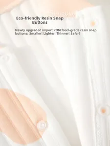 Macro detail of safe food-grade POM resin snaps on the quilted infant bodysuit