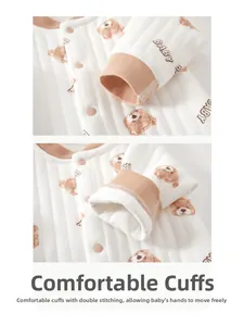 Detail of baby quilted cotton bodysuit showing double-layered sleeve cuffs and seams