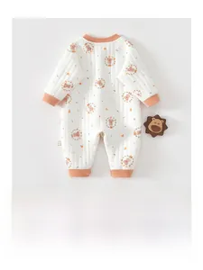 Close-up of baby romper showing quilted cotton texture and cute bear floral print