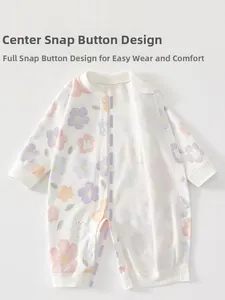 Close-up of baby cotton romper featuring snap button design and cute floral rabbit print