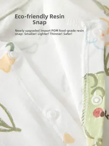 Détails des pressions en résine alimentaire sur une grenouillère bébé en coton