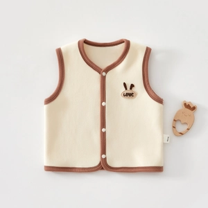 Macro detail of toddler fleece vest with love embroidery and soft polar fleece texture