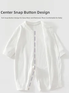 Detail of baby white cotton ribbed romper with snap buttons for easy dressing