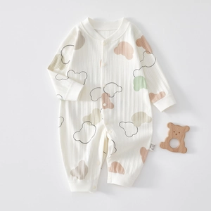 Close-up of baby romper showing cotton ribbed texture and cute bear pattern details
