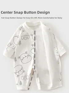Detail of snap button design on white cotton baby romper with cartoon hippo print