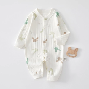 Detail of ribbed cotton baby romper featuring cute rabbit prints and snap buttons