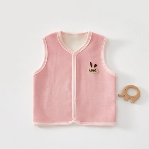 Detailed view of pink fleece vest with soft lining and cute rabbit ear decoration