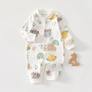 Detail of infant long sleeve romper with colorful cartoon prints and snap buttons