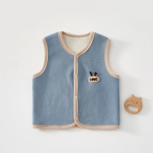Detail of light blue fleece baby vest featuring cute LOVE embroidery and soft texture