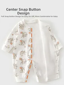 Detail view of cotton baby bodysuit featuring rabbit prints and easy-access snap buttons