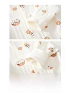 Detail of comfortable baby romper cuffs with panda print and double-stitched seams