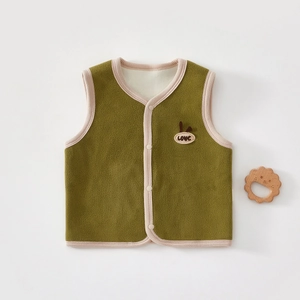 Detail of baby fleece vest in green with pink piping and rabbit embroidery