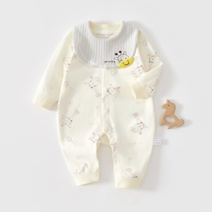 Detail view of cotton baby onesie with giraffe prints and safety Class A wash label
