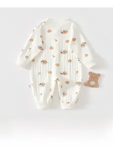Detail of ribbed cotton baby romper featuring cute panda and peach cartoon patterns