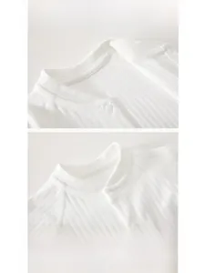 Detail of ribbed cotton baby onesie neckline with snap buttons and bear print