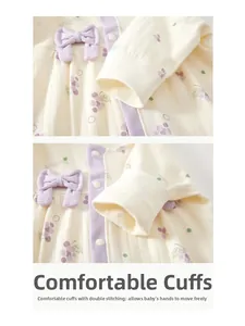 Detail of baby romper featuring purple grape print and 3D bow decoration on soft cotton