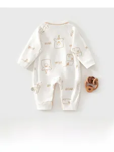 Detail of baby cotton onesie featuring cute bear prints and soft knitted fabric texture