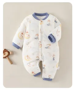 Detail of baby winter padded jumpsuit featuring moon prince prints and blue ribbed trims