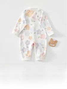 Detailed close-up of newborn long-sleeve cotton romper with cute bunny and floral print