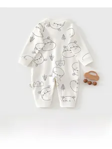 Detail of white cotton infant romper with black hippo print and ribbed cuffs