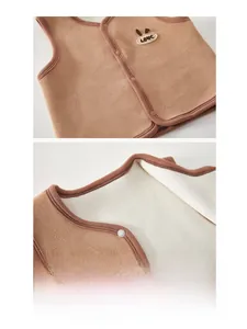 Close-up of baby polar fleece vest featuring thick double-sided fabric and rabbit embroidery