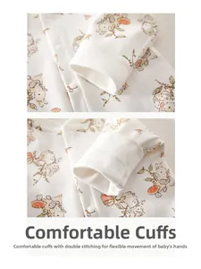 Detail of baby cotton jumpsuit cuffs with rabbit print and reinforced double stitching