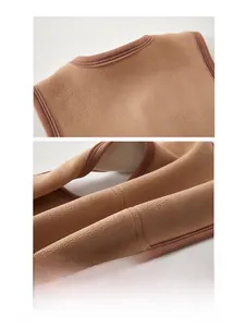 Detailed macro view of the brown fleece vest showing seamless edge piping craftsmanship