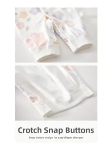 Close-up of cotton baby romper featuring snap buttons at crotch for easy diaper changes