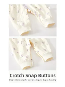 Detail of infant floral romper featuring convenient resin snap buttons on the crotch area