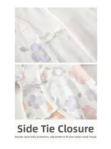 Detail of baby cotton kimono romper with floral rabbit print and secure side tie closure