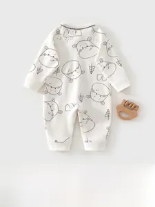 Vue détaillée du barboteuse pour bébé en coton avec motifs d'hippopotame et d'arbre