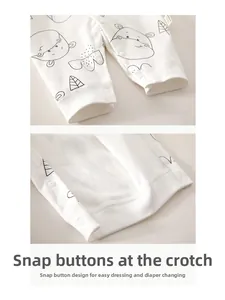 Close-up of snap-button crotch on soft cotton baby romper with cute hippo pattern