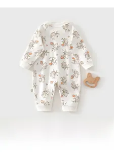 Detail of newborn cotton romper with cartoon rabbit prints and ribbed sleeve cuffs