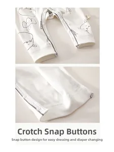 Close-up of white cotton baby romper featuring easy-to-use resin snap buttons at the crotch