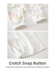 Detailed macro view of plastic snaps on the crotch of a floral cotton infant bodysuit