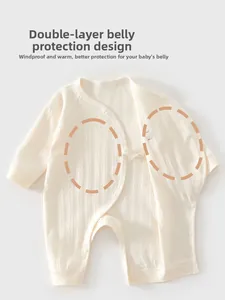Detail of baby romper featuring a double-layer belly protection and striped cotton fabric
