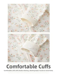 Détail d'un body floral pour bébé avec poignets côtelés et finitions à double couture