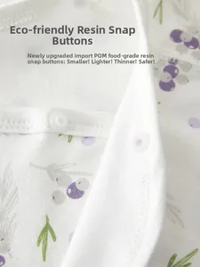 Detail of baby garment featuring non-toxic POM resin snap buttons and soft cotton fabric