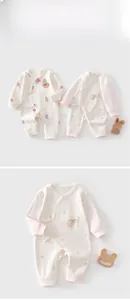 Detailed view of side-tie cotton newborn romper with cute animal embroidery pattern
