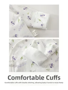 Detailed macro view of double-stitched cuffs on 100% cotton long-sleeve newborn baby shirt