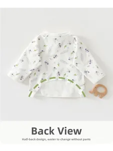 Detail view of cotton newborn kimono top showing half-back design for easy diaper changes